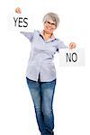 Happy elderly woman holding a paper card and choosing between Yes or No choice