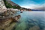 Rocky Beach and Small Village near Omis at Dusk, Croatia