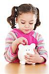 Stock image of little girl saving coin on her piggy bank over white background