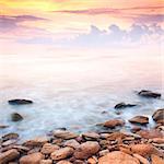 beautiful sunrise over the rocky sea coast, wonderful world