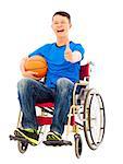 hopeful young man sitting on a wheelchair with a basketball and thumb up