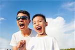 closeup of father and son are shouting in outdoors