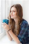 Cute, beautiful woman with cup of tea