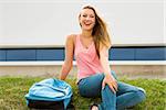 Beautiful and happy teenager studying in outdoor