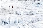 Two people trekking on ice Vatnajokull glacier, iceland