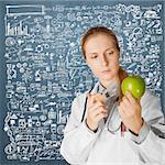 scientist woman does injection to an apple, isolated on different backgrounds