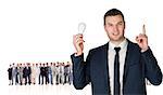 Composite image of businessman holding light bulb and pointing against group of workers