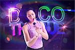 Pretty girl singing against digitally generated colourful discotheque text