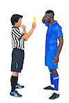 Referee showing yellow card to football player on white background