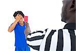 Serious referee showing red card to player on white background