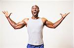 Portrait of a muscular man shouting over white background