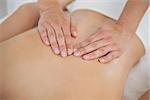 Woman enjoying a back massage  at the health spa