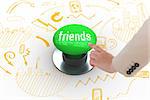 The word friends and businesswoman pointing against digitally generated green push button