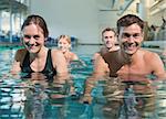 Fitness class using underwater exercise bikes in swimming pool at the leisure centre