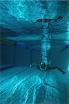 Fit swimmer training on his own in the swimming pool at the leisure centre