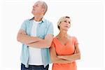 Thinking older couple with arms crossed on white background