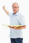 Serious preacher man pointing and holding gospel on white background