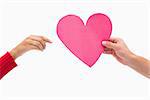 Man passing woman pink heart on white background