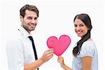 Pretty brunette giving boyfriend her heart on white background