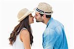 Happy hipster couple about to kiss on white background