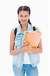 Pretty student smiling at camera on white background