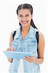 Pretty student using her tablet pc on white background