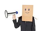 Businessman with box on head holding megaphone on white background