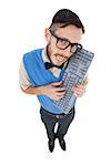 Geeky hipster looking at camera holding keyboard on white background