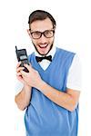 Geeky hipster holding a retro cellphone on white background