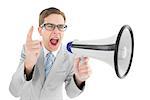 Geeky businessman shouting through megaphone on white background