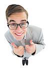 Geeky hipster smiling at camera with thumbs up on white background