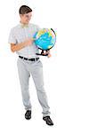 Geeky hipster holding a globe smiling at camera on white background
