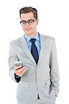 Geeky businessman sending a text on white background