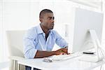 Focused businessman working at his desk in his office