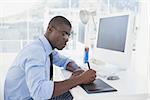 Focused businessman working at his desk in his office