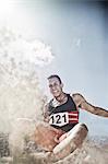 Long jumper landing in sand