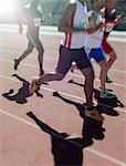 Runners racing on track