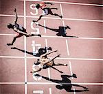 Runners crossing finish line on track