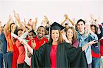 Crowd cheering behind confident graduate