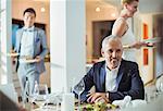 Man sitting at table at dinner party