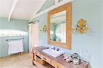 Sink and mirror in rustic bathroom