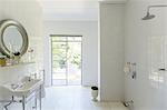 Glass door in rustic bathroom