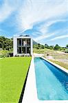 Modern swimming pool under blue sky