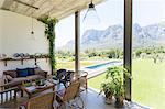 Living room overlooking backyard and landscape