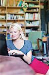 Woman using laptop in living room