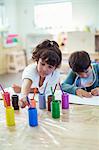 Students painting in classroom