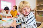 Student smiling in classroom