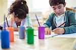 Students painting in classroom