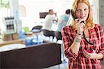 Woman talking on phone in office