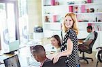 People working at conference table in office